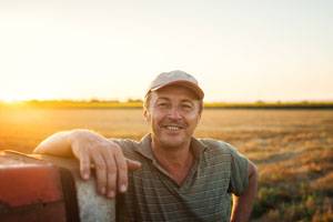 Farmland behind man